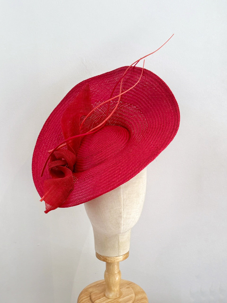 Red curvy  disc hat